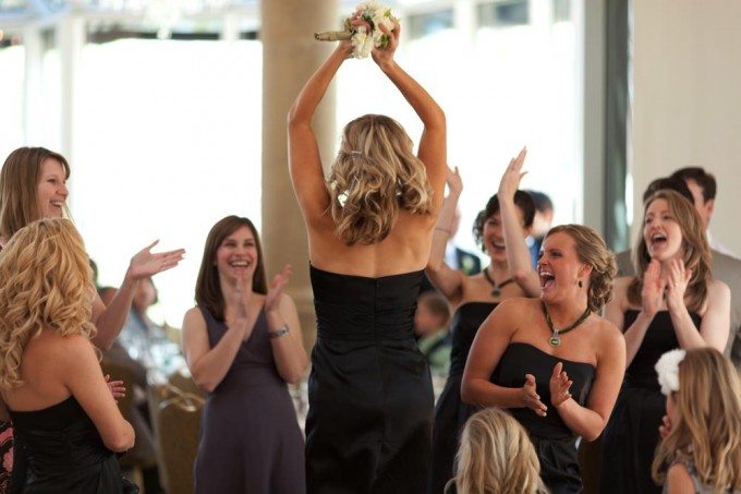 girls celebrate after a bouquet catch