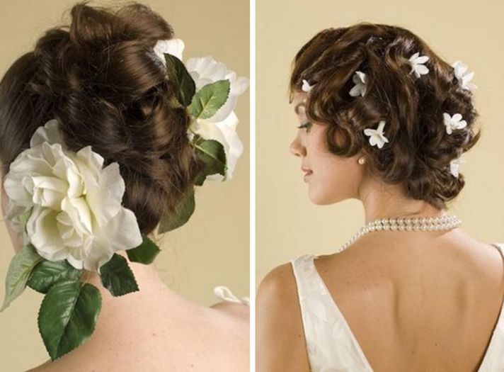Large white flowers with green leafs & Many small, white flowers accent brides hairstyle