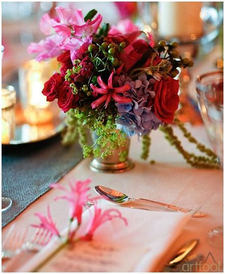 Beautiful low table centerpiece with funky, vibrant flowers