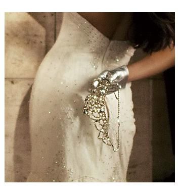 Sassy short silver metallic gloves worn with a white strapless wedding dress