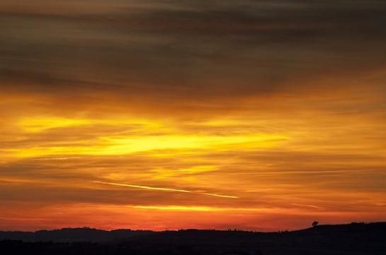 Beautiful, vibrant orange and yellow tuscan sunset, the perfect backdrop for a fairytale wedding