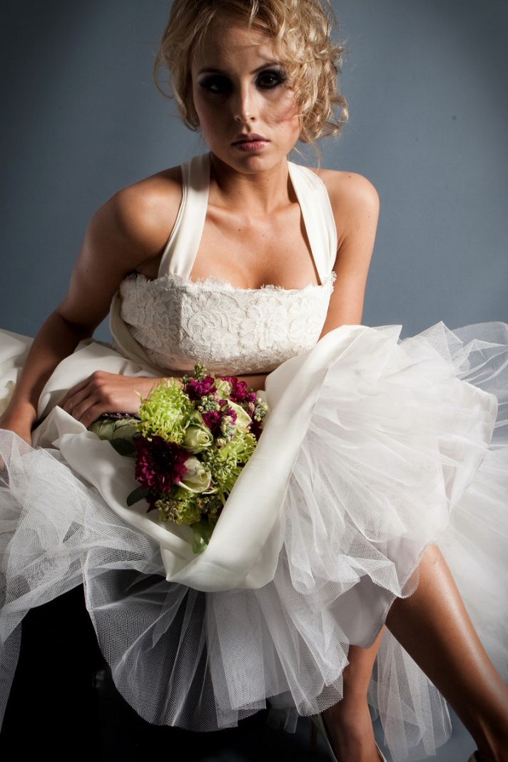Stunning lace corset wedding dress with halter neckline and full tulle skirt