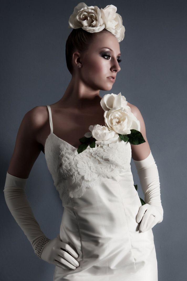 Sheath style ivory wedding dress with touches of lace and floral bridal headpiece