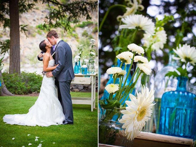 Bride and groom kiss after saying I Do; white, green, aqua wedding reception centerpieces
