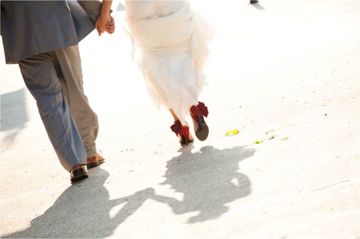 Milwaukee bride and groom walk hand in hand after saying I Do