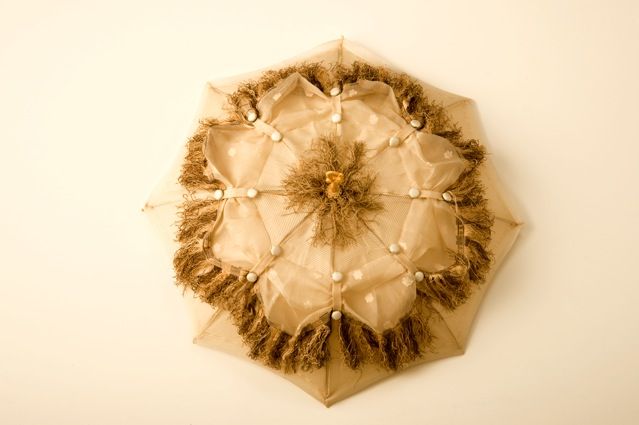 Organic vintage wedding parasol with ivory silk buttons and green fringe