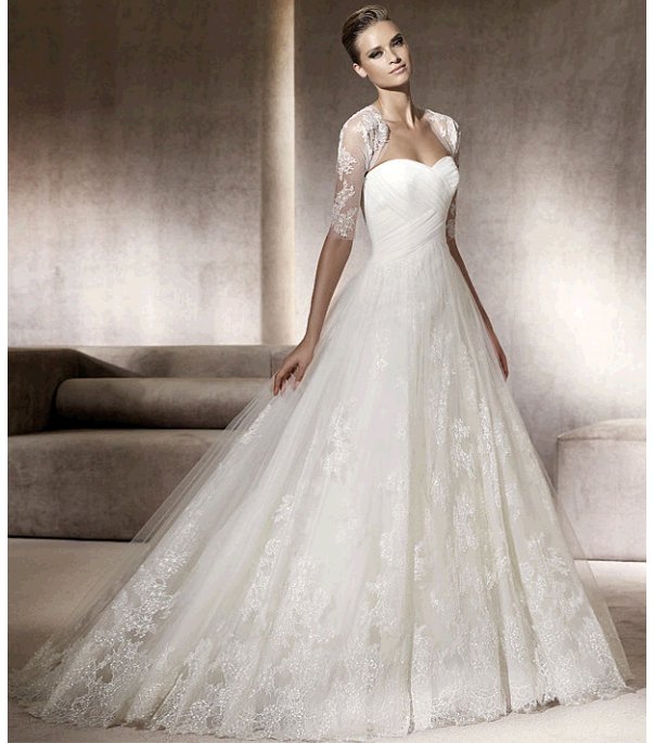 Romantic full a-line Pronovias wedding dress with lace bolero