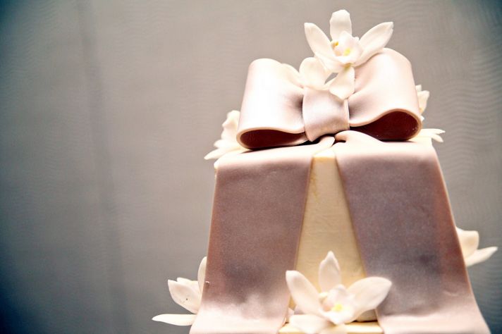 Ivory fondant square wedding cake with orchid sugar flowers