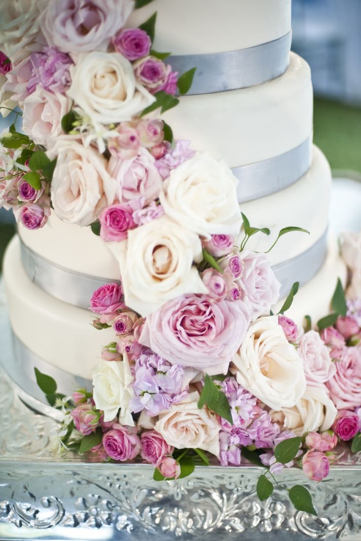 romantic wedding cake with cascading roses