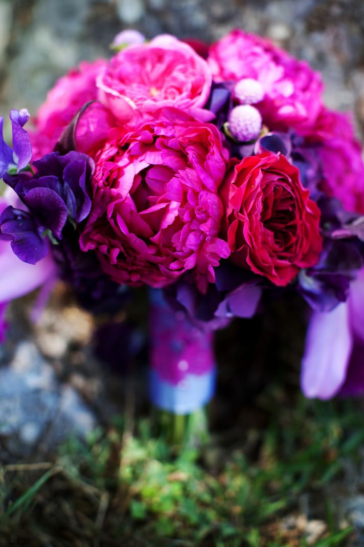 elegant malibu wedding with bold wedding flowers purple pink bouquet