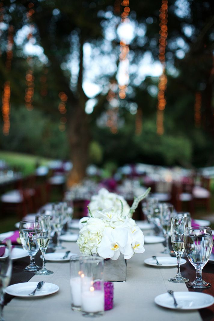 outdoor wedding reception long banquet tables ivory wedding flowers