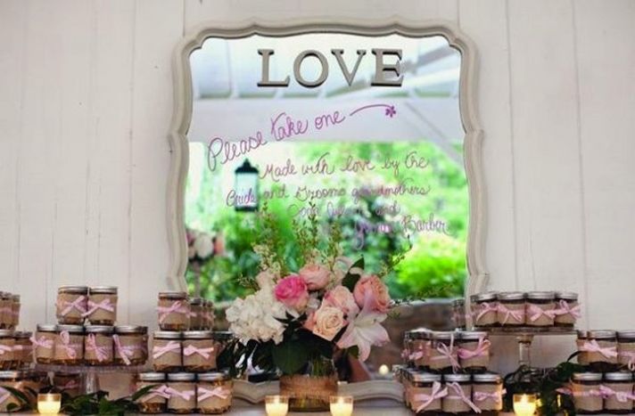 vintage romance wedding guest favors with mirror backdrop