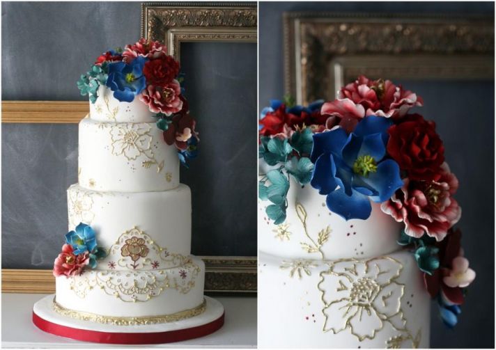 Elegant White and Gold Wedding Cake with Jewel Tone Blooms