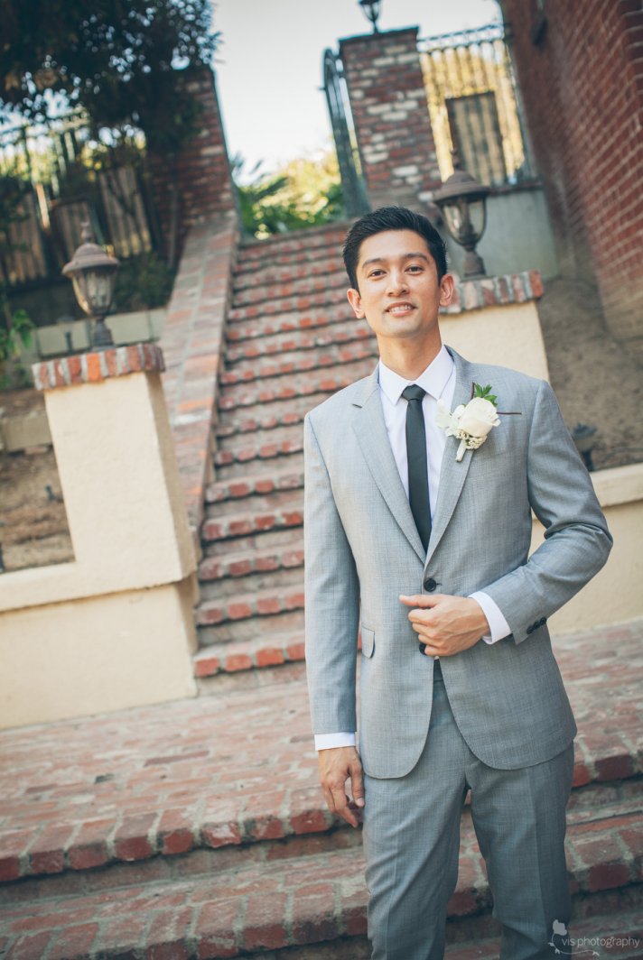 dapper California groom wears light gray suit