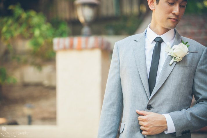 dapper California groom wears light gray suit