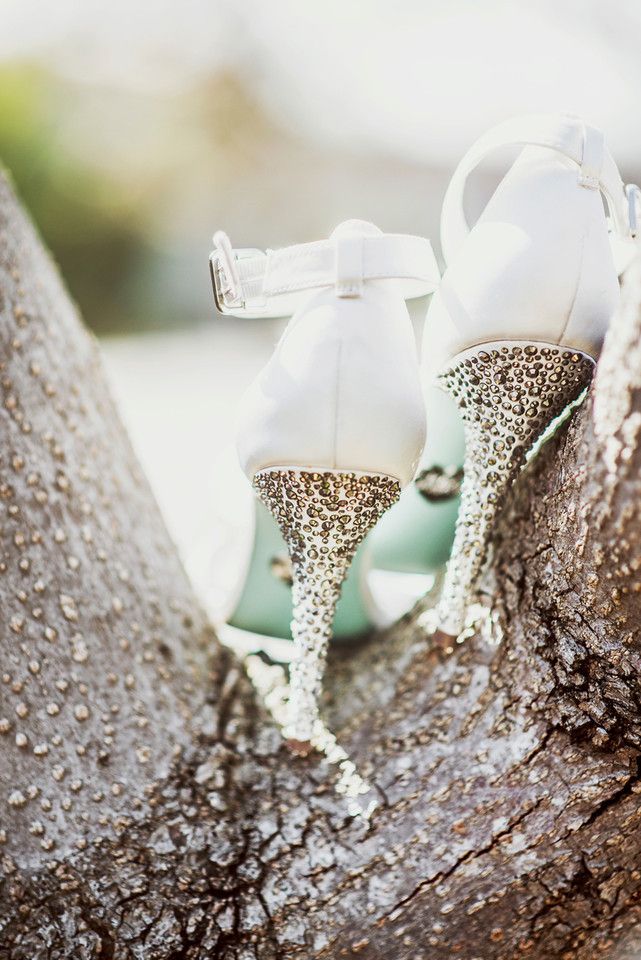 White wedding shoes with metallic studded heels