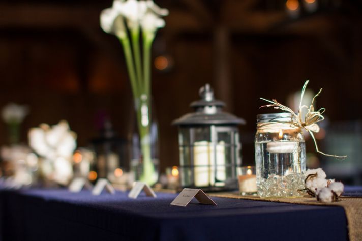 Bride and groom make fun entrance into rustic reception venue