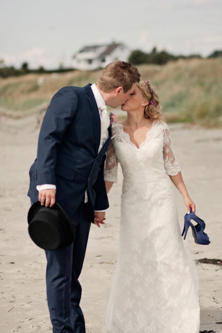 Real wedding kiss on the beach