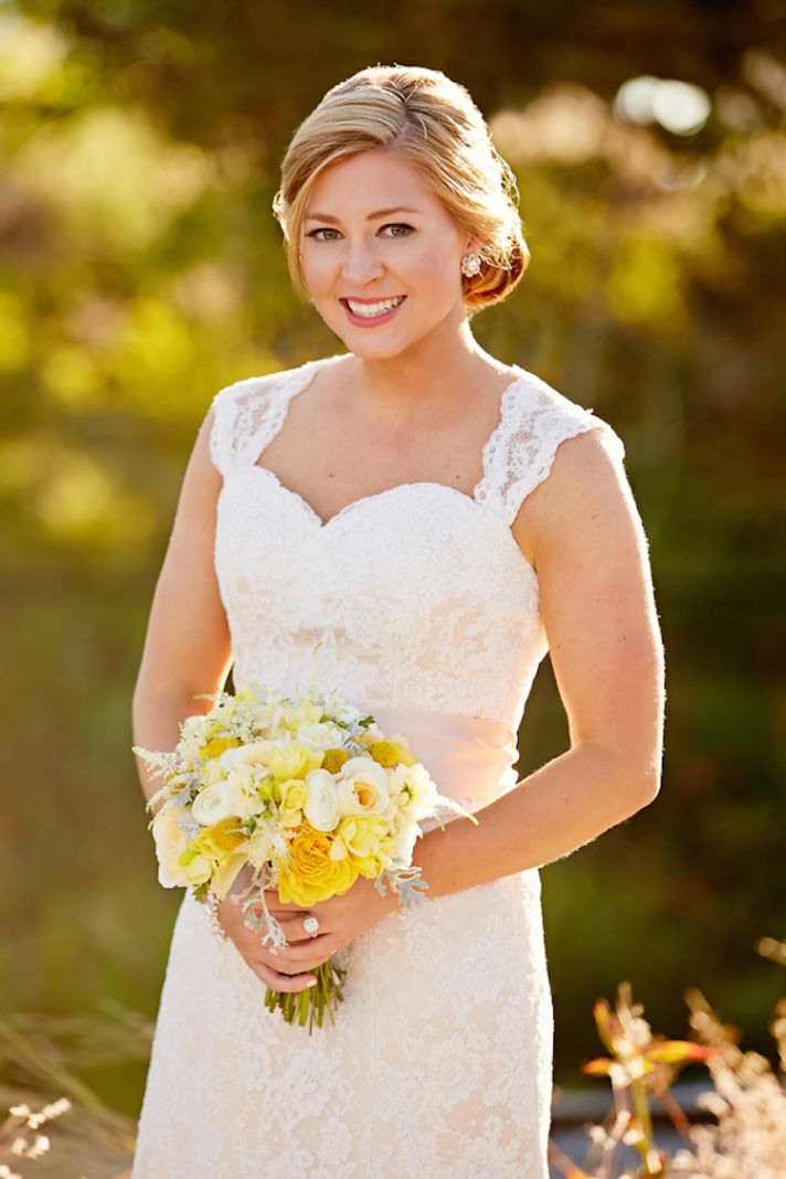Lovely Bride in a Lace Gown and Yellow Bouquet