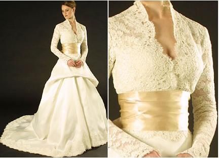 Beautiful ivory Monique Lhuillier lace wedding dress with v-neck and champagne cumberbund