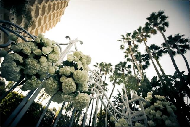 Four Seasons Beverly Hills- outdoor terrace for wedding ceremony, with ivory wedding flowers galore