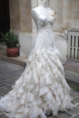 Ivory a-line wedding dress with deep v neckline and ruffle tiered skirt