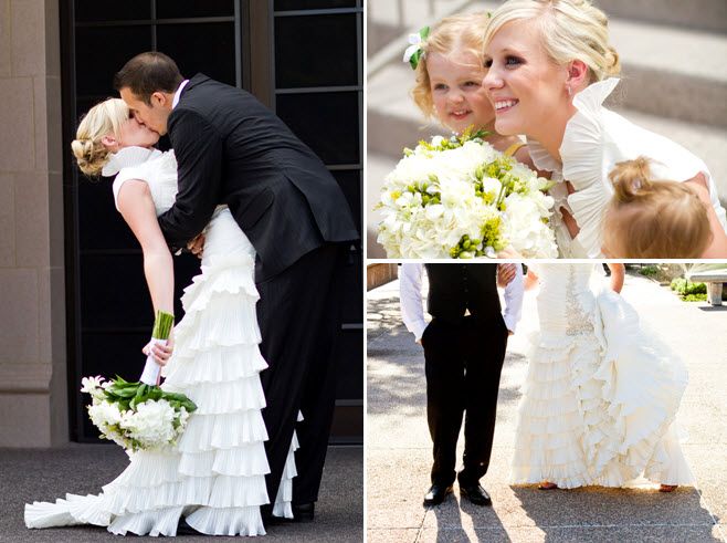 Groom in black tux dips his beautiful bride after saying I Do