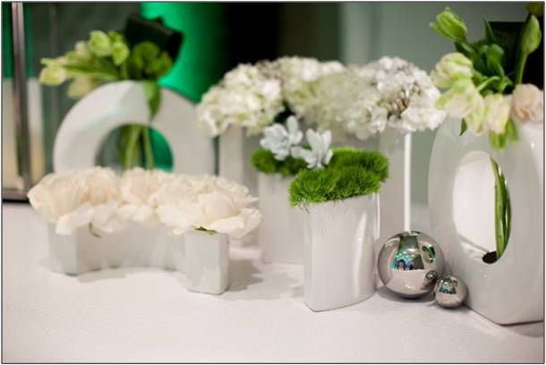 Modern and fresh white, green and silver wedding ceremony flower arrangements