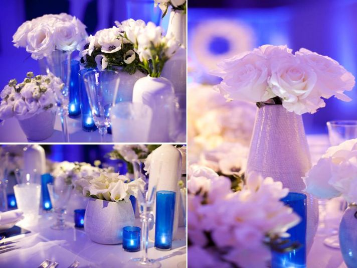 Modern wedding reception decor- blue lighting, white flowers and lounge furniture