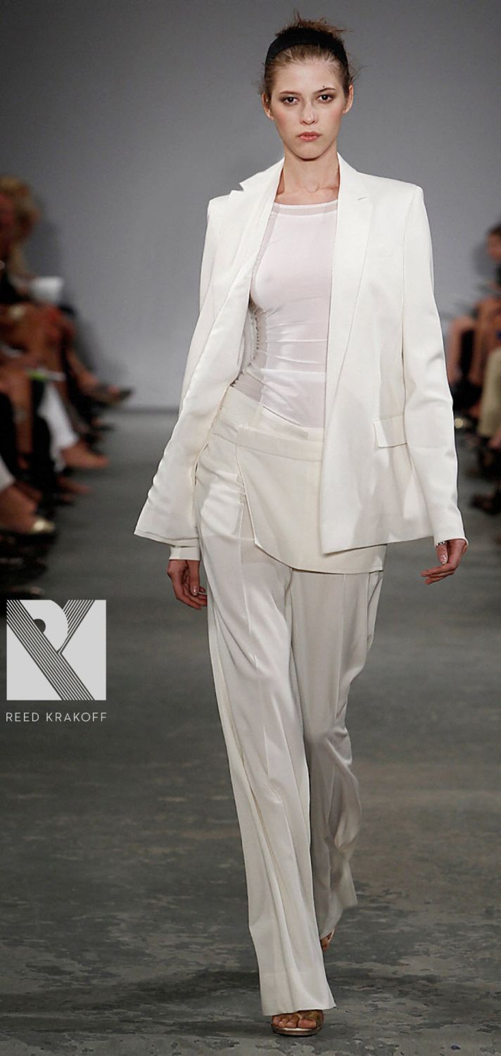 Chic Donna Karen all-white tailored suit with wide-legged pants and metallic belt
