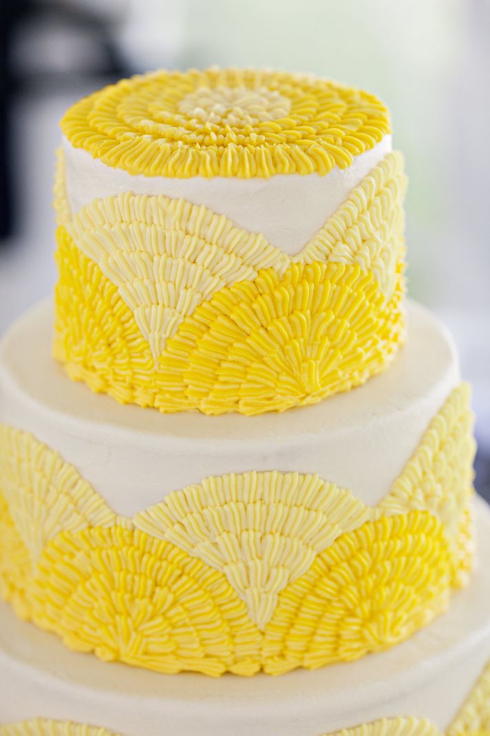 Bright yellow and white classic wedding cake