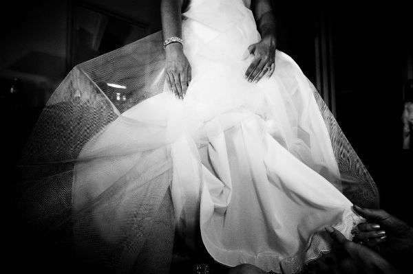 Artistic wedding photo of bride’s ivory wedding dress with tulle underlay