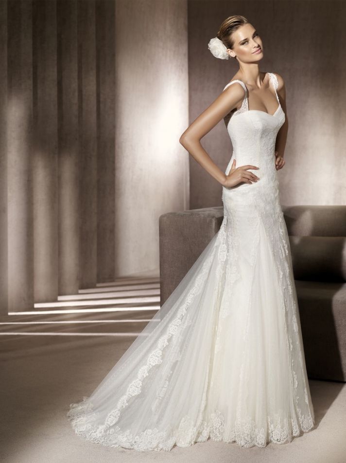 Classic ivory lace wedding dress with statement straps