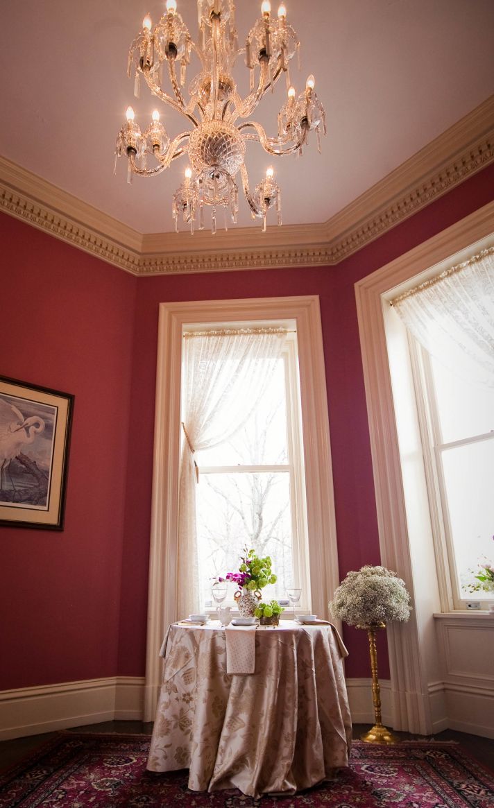 Elegant wedding reception venue with orchid wedding flower centerpieces
