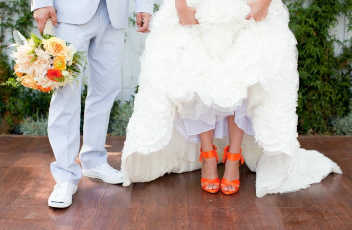 bride wears white wedding dress hot orange heels