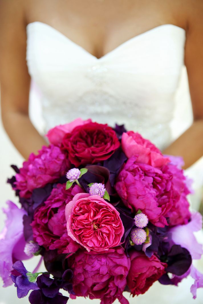 elegant malibu wedding with bold wedding flowers pink purple bridal bouquet