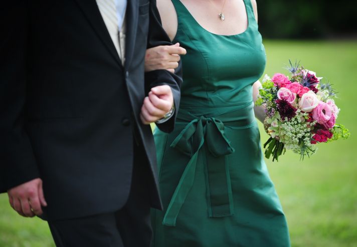 real wedding photography planning inspiration bridesmaid wears green dress rose bouquet