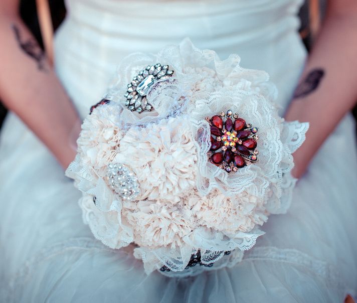 Alternative bridal bouquet with lace and vintage brooches