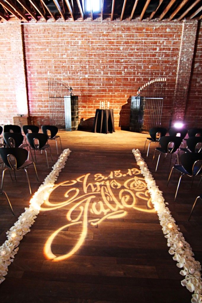 custom wedding monogram lighting on ceremony aisle