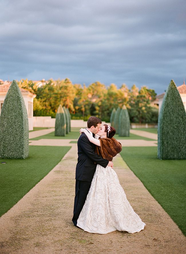 California bride wears brown fur stole with ball gown wedding dress
