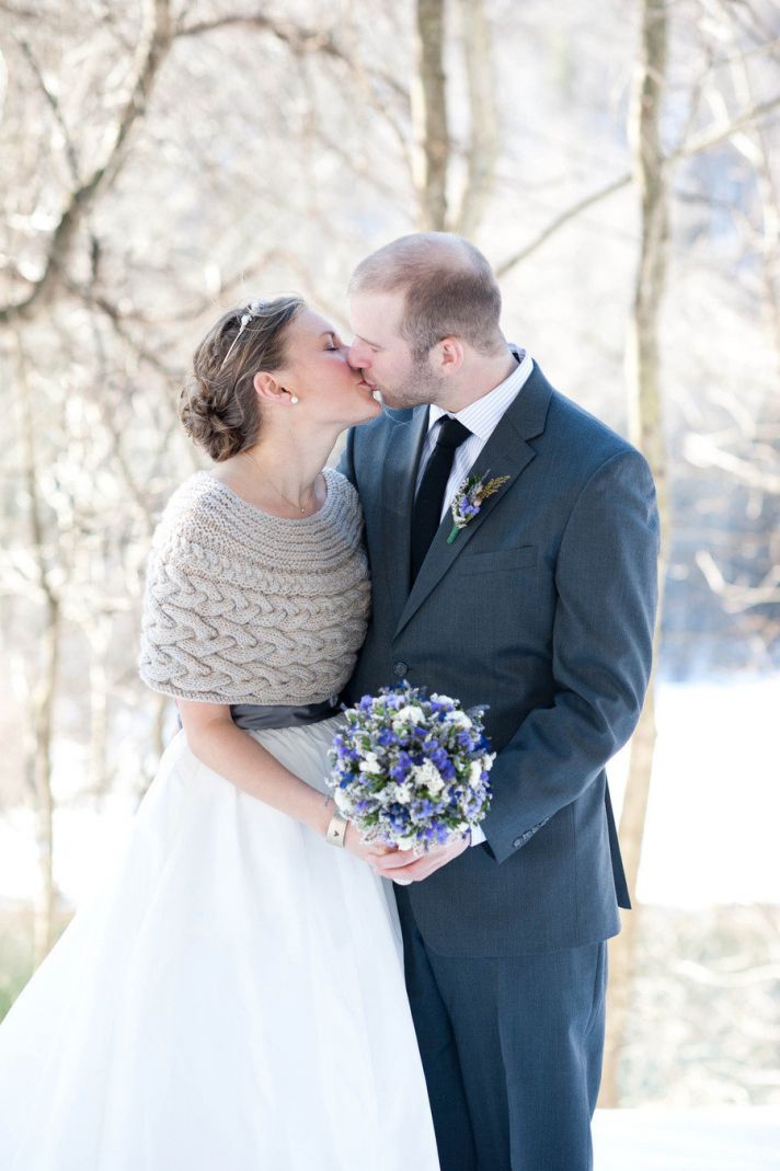 winter bride wears cableknit wedding sweater