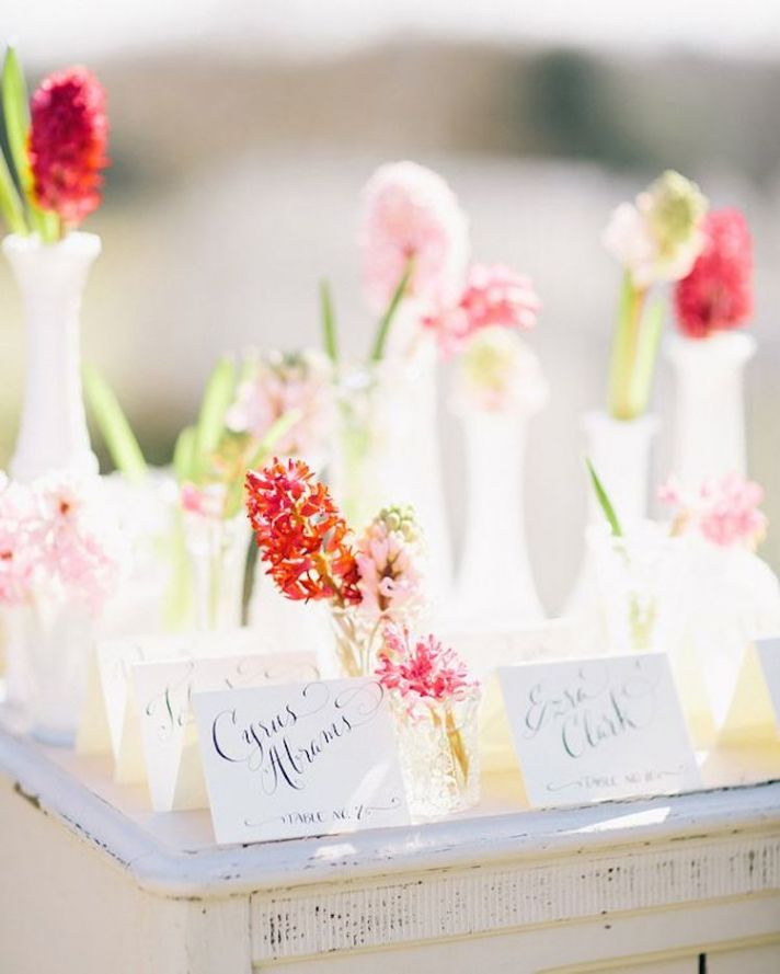 Pretty Escort Card Table Filled With Flowers