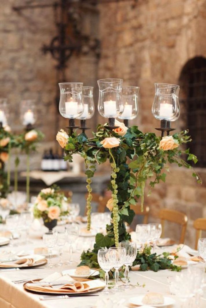 Romantic Candelabra Centerpiece Covered in Foliage