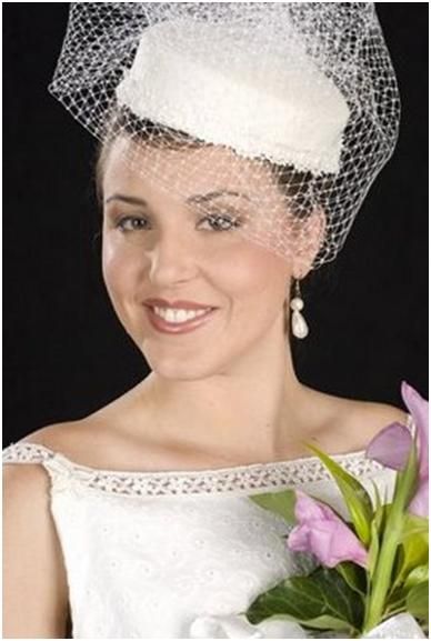 The Pillbox Hat: Beautiful bride wears white hat with white netting