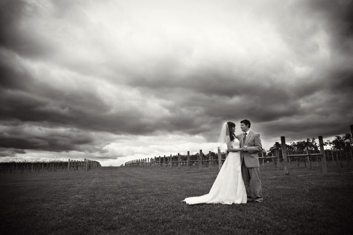 Stunning artistic wedding photo, with cloudy sky in background