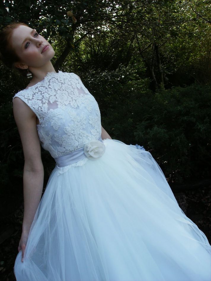White lace classic wedding dress with bateau neckline and dusty rose sash