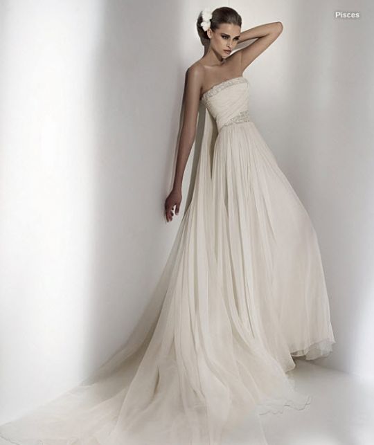 Beautiful grecian-inspired strapless ivory wedding dress