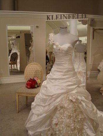 Stunning ivory asymmetric ballgown wedding dress with ruffled skirt by Pnina Tornai