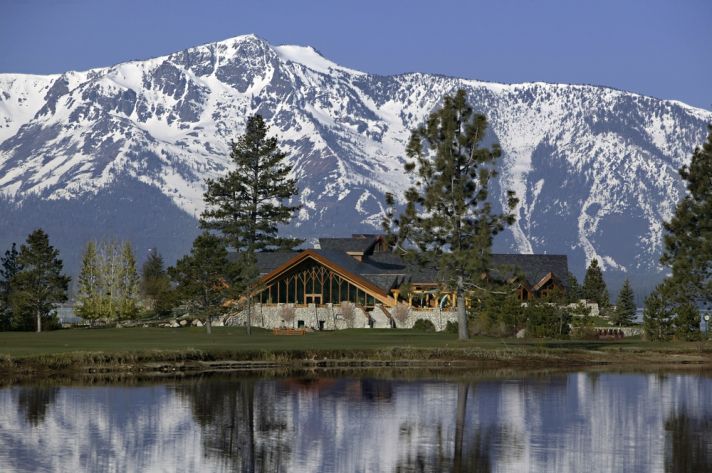 Rustic wedding venue in Lake Tahoe with snow-covered mountains in back