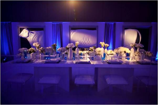 Something Blue wedding reception room with all-white flowers